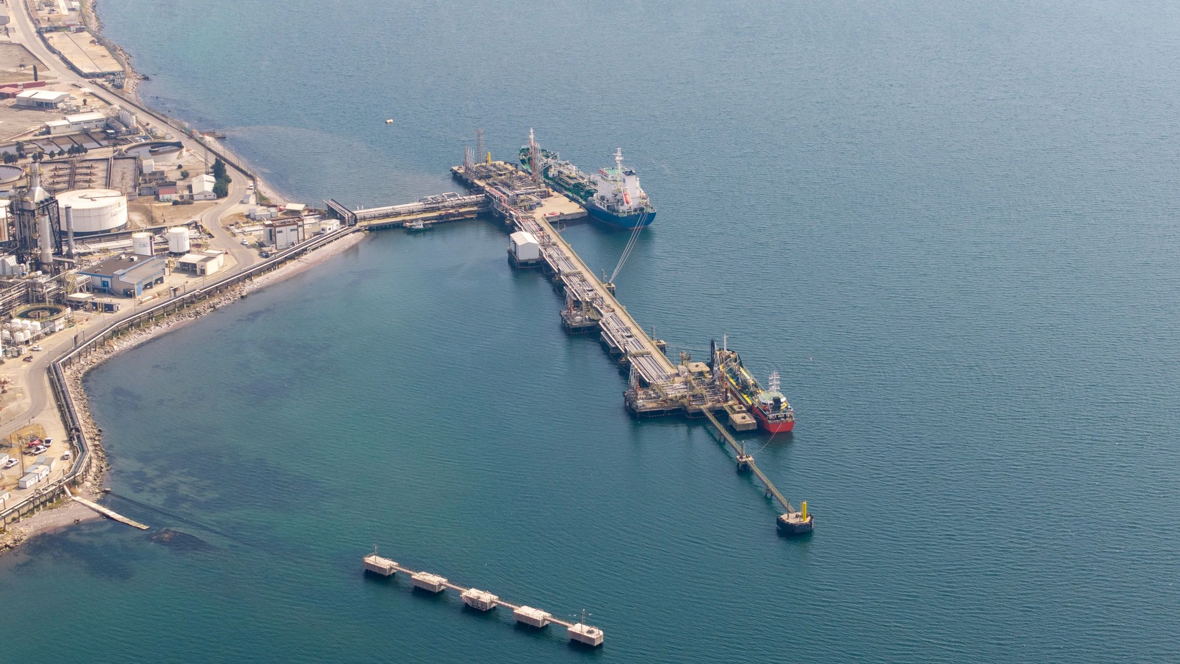 Aerial view of oil terminal with storage and dock infrastructure
